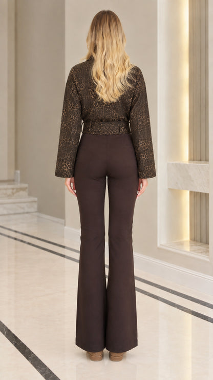 Back view of model wearing the tailored coffee brown textured jacket