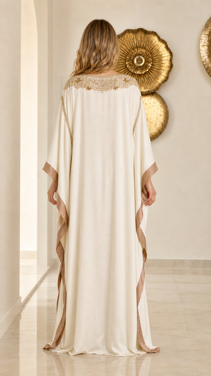 Back view of flowing cream full-length kaftan gown