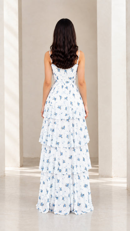 Back view of model in white floral tiered maxi dress showing strap and back detail