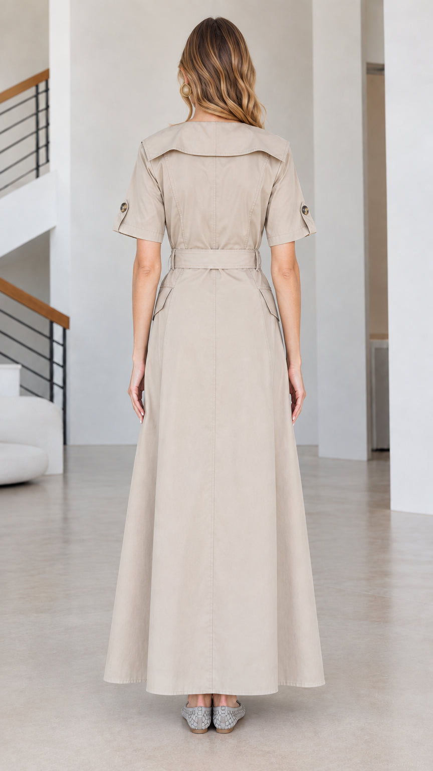Back view of beige short-sleeve trench maxi dress with wide collar and belt