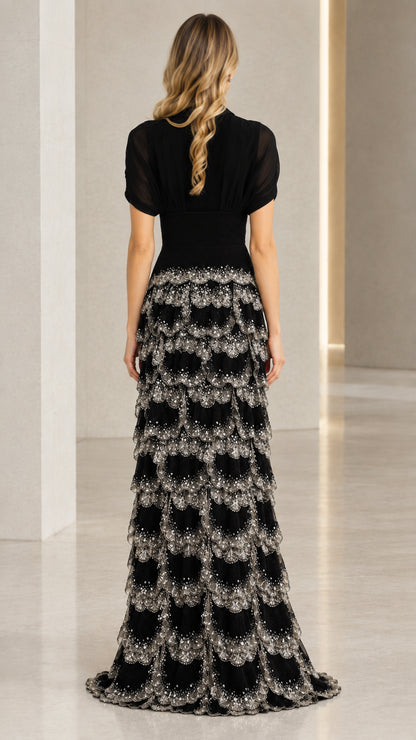 Back view of black floor-length beaded evening gown