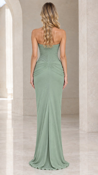Back view of woman wearing floor-length strapless sage green formal gown