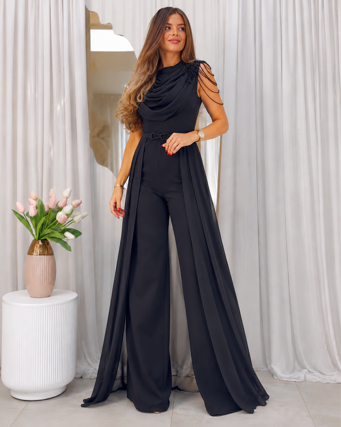 Full front angle of black sleeveless wide leg jumpsuit with waist detail