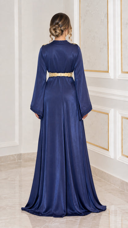Back view of navy blue satin kaftan dress showing waist belt and full length drape