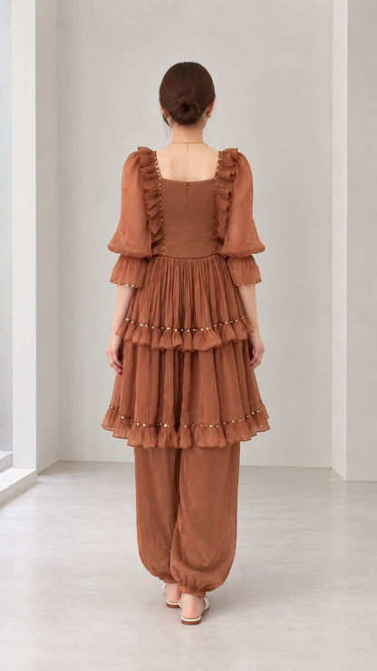 Back view of woman wearing Rust Brown square neck tiered ruffle matching outfit