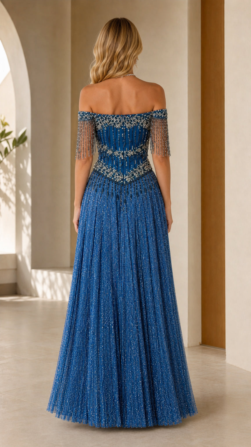 Back view of royal blue off-the-shoulder beaded evening gown