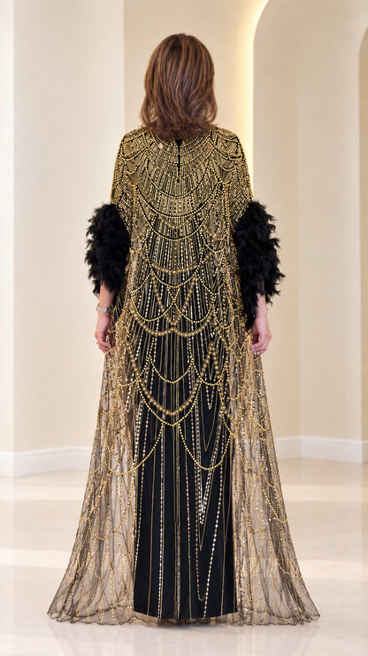 Back view of black beaded cape evening maxi dress