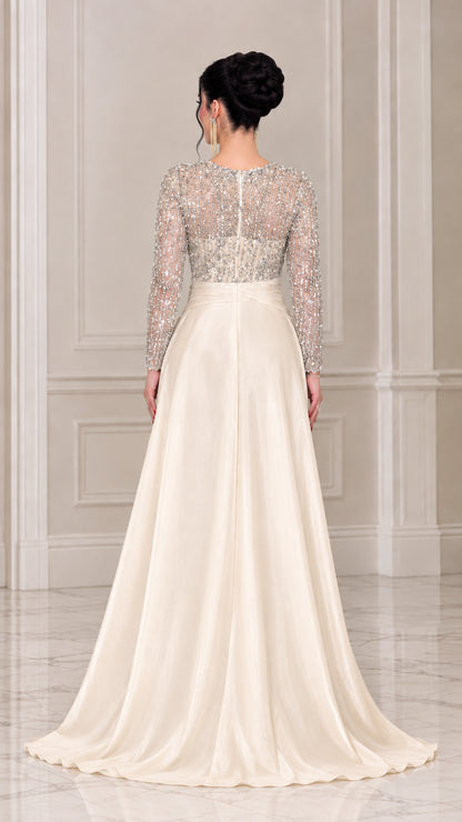 Back view of the champagne sequin evening dress highlighting the zippered back and satin train