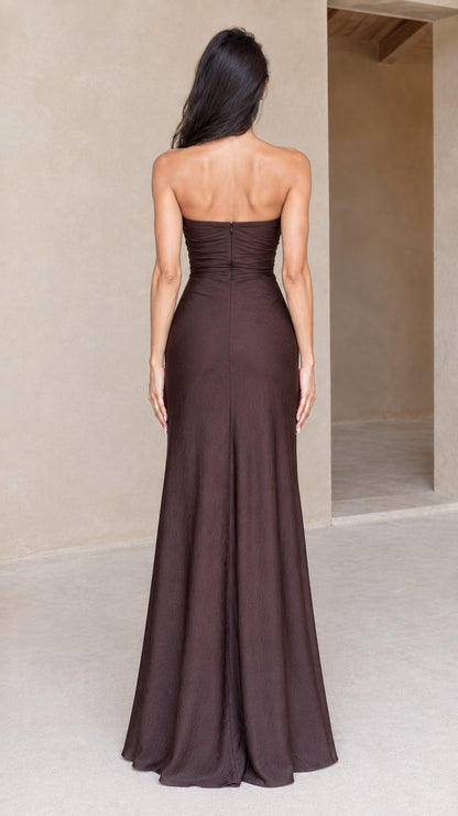 Back full-length view of chocolate brown strapless maxi dress