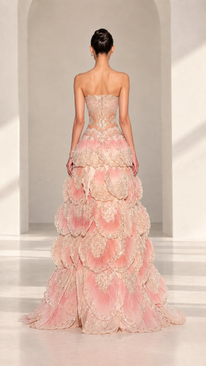 Back view of Blush Pink strapless evening gown showing corset back and subtle train