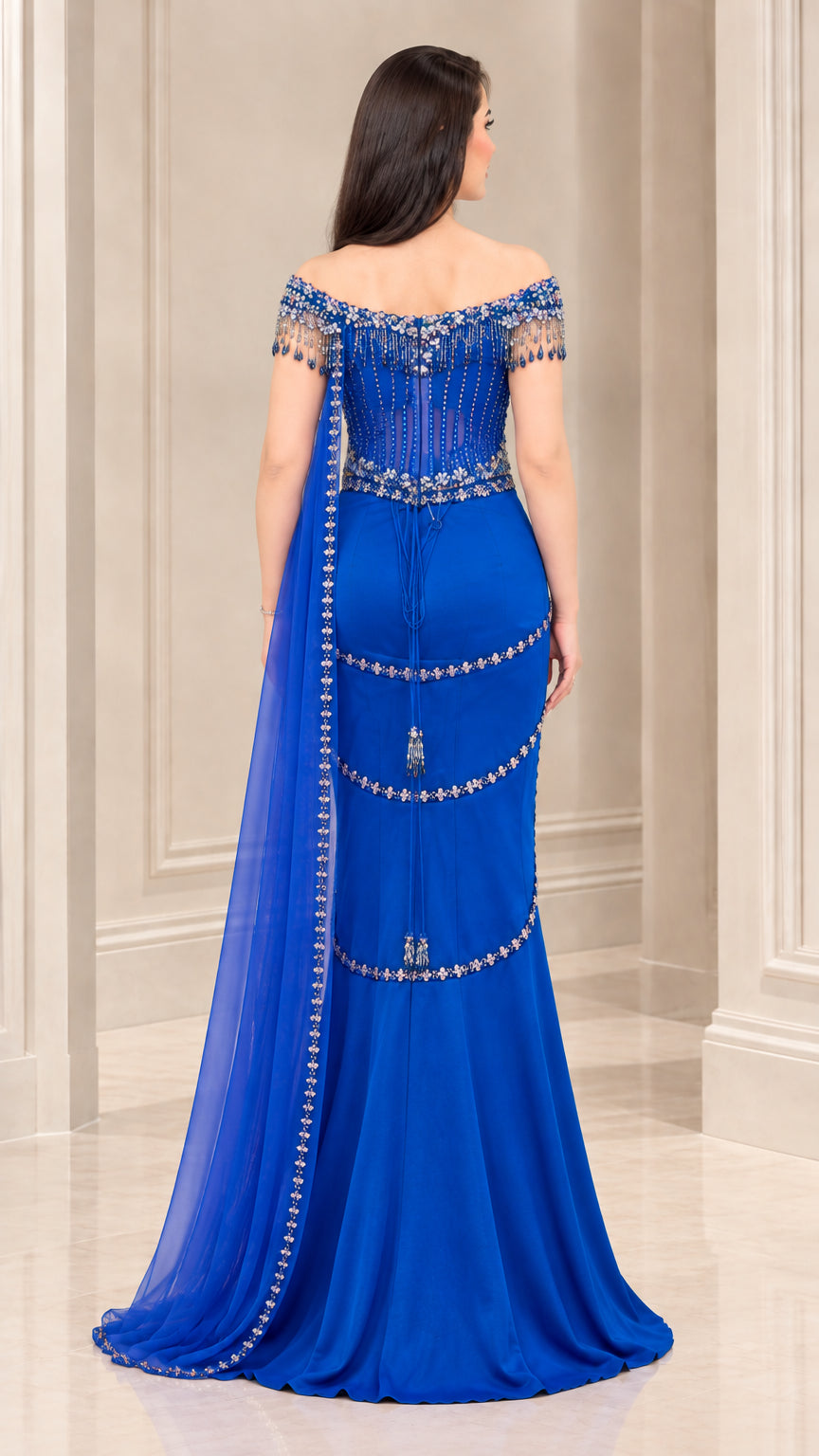 Back view of Royal Blue floor-length mermaid gown showing sheer back streamer drape