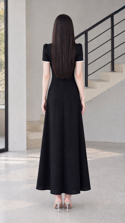Back view of black modern cheongsam maxi dress showing clean silhouette