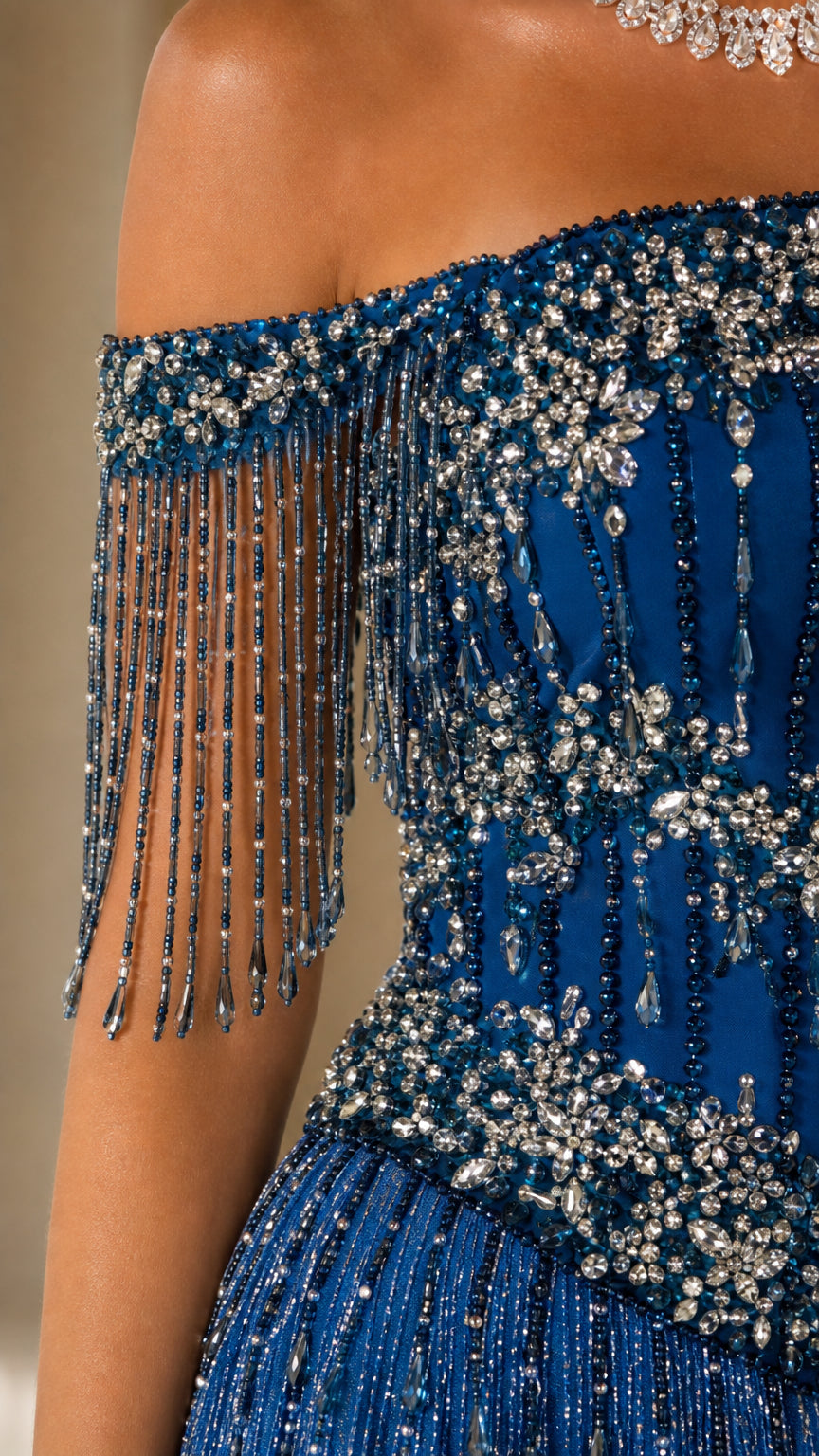 Close-up detail of beaded fringe sleeve and crystal embellished bodice