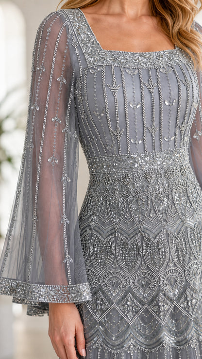 Close-up detail of intricate beadwork, sequins, square neckline, and flared mesh sleeve