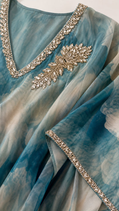 Close up of crystal rhinestone embellishments on V-neck and trim