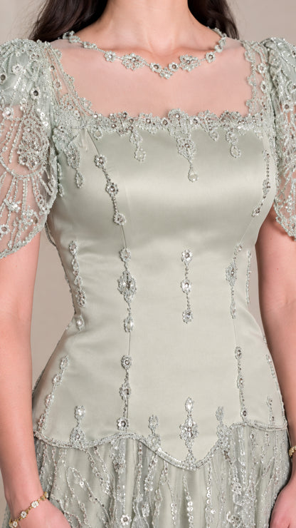 Close-up detail of Sage Green embroidered bodice, illusion neckline, and beading