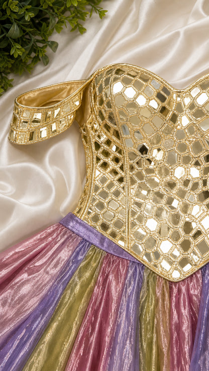 Close-up detail of gold geometric mirror embellishments on sweetheart neckline bodice and off-shoulder strap