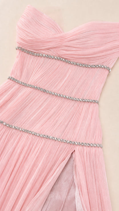 Close-up detail of blush pink pleated bodice with sparkling horizontal rhinestone bands