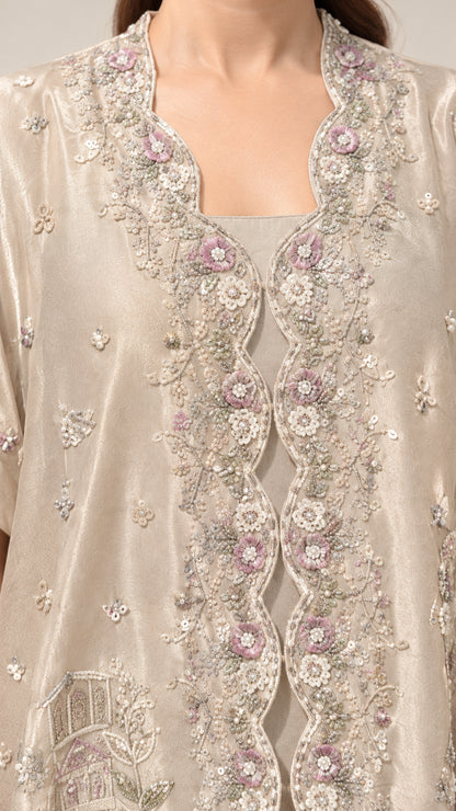Close-up of intricate floral embroidery and beadwork on the champagne neckline and bodice