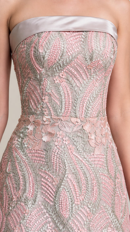 Close up of intricate embroidery and satin band neckline detail