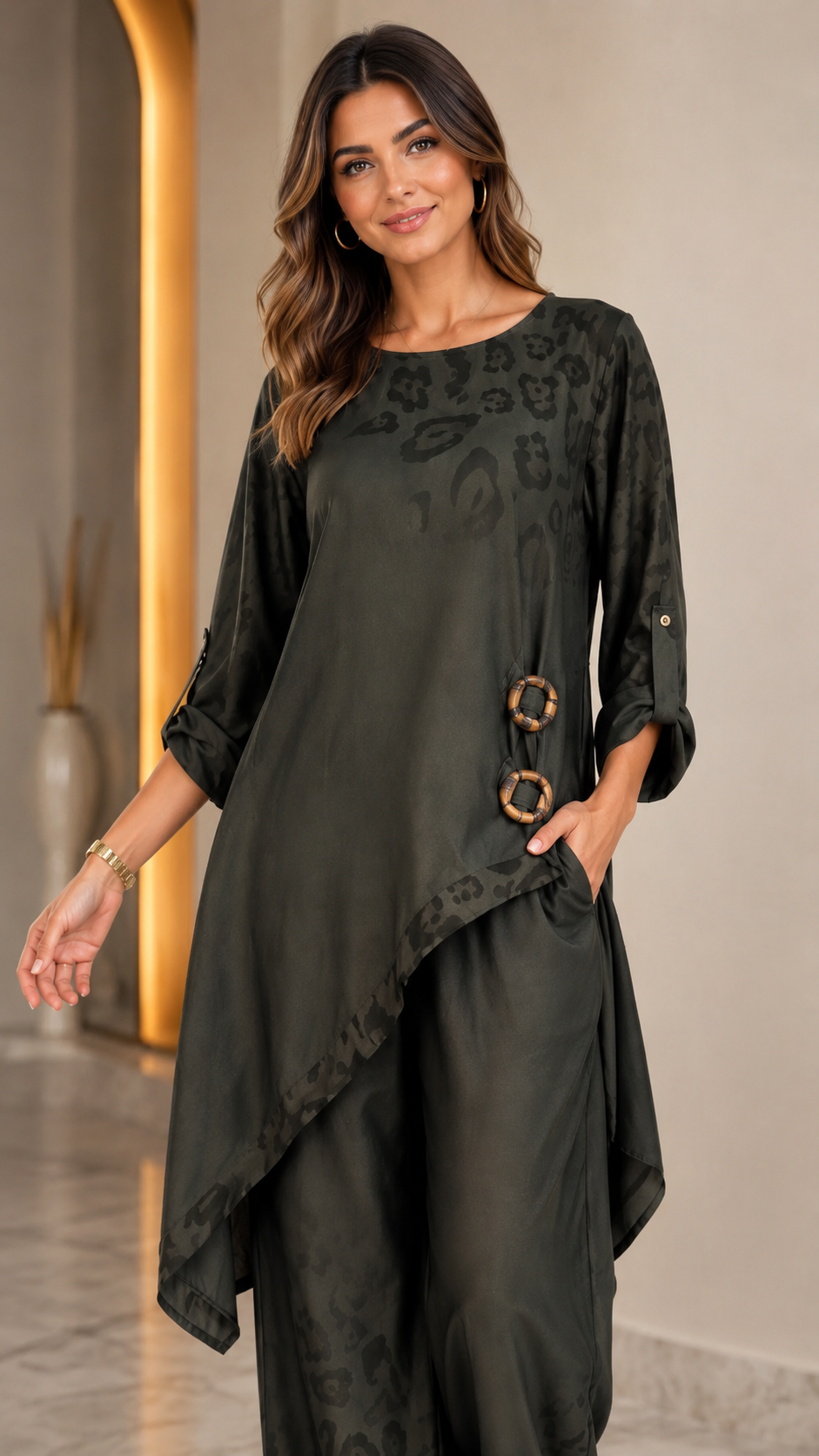 Close front view of olive asymmetrical tunic two piece set with ring detail