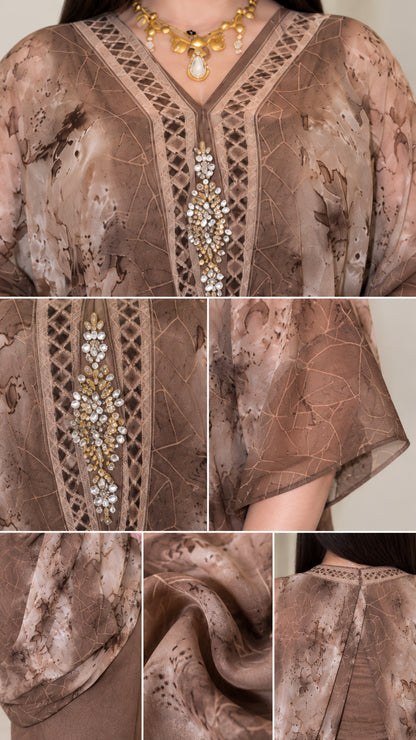 Close-up details of rhinestone neckline embellishments and sheer printed chiffon fabric