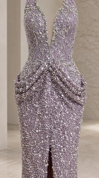 Close-up detail of embellished beaded texture and draped hip swag detail