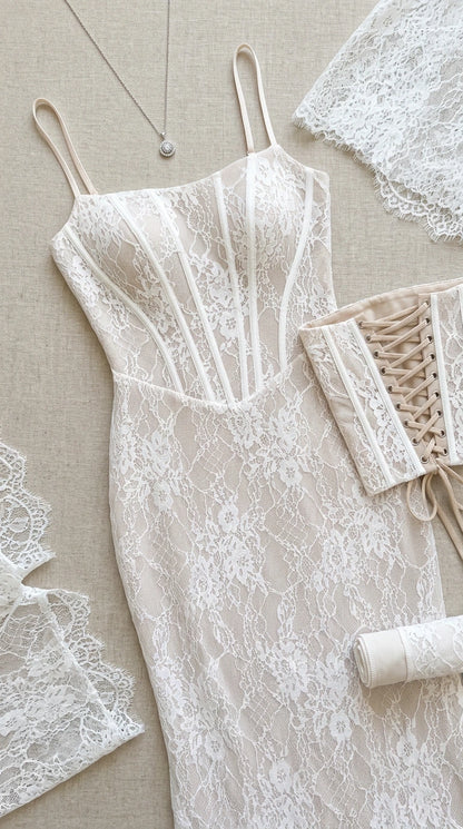 Flat lay view of white corset lace dress and lace-up details