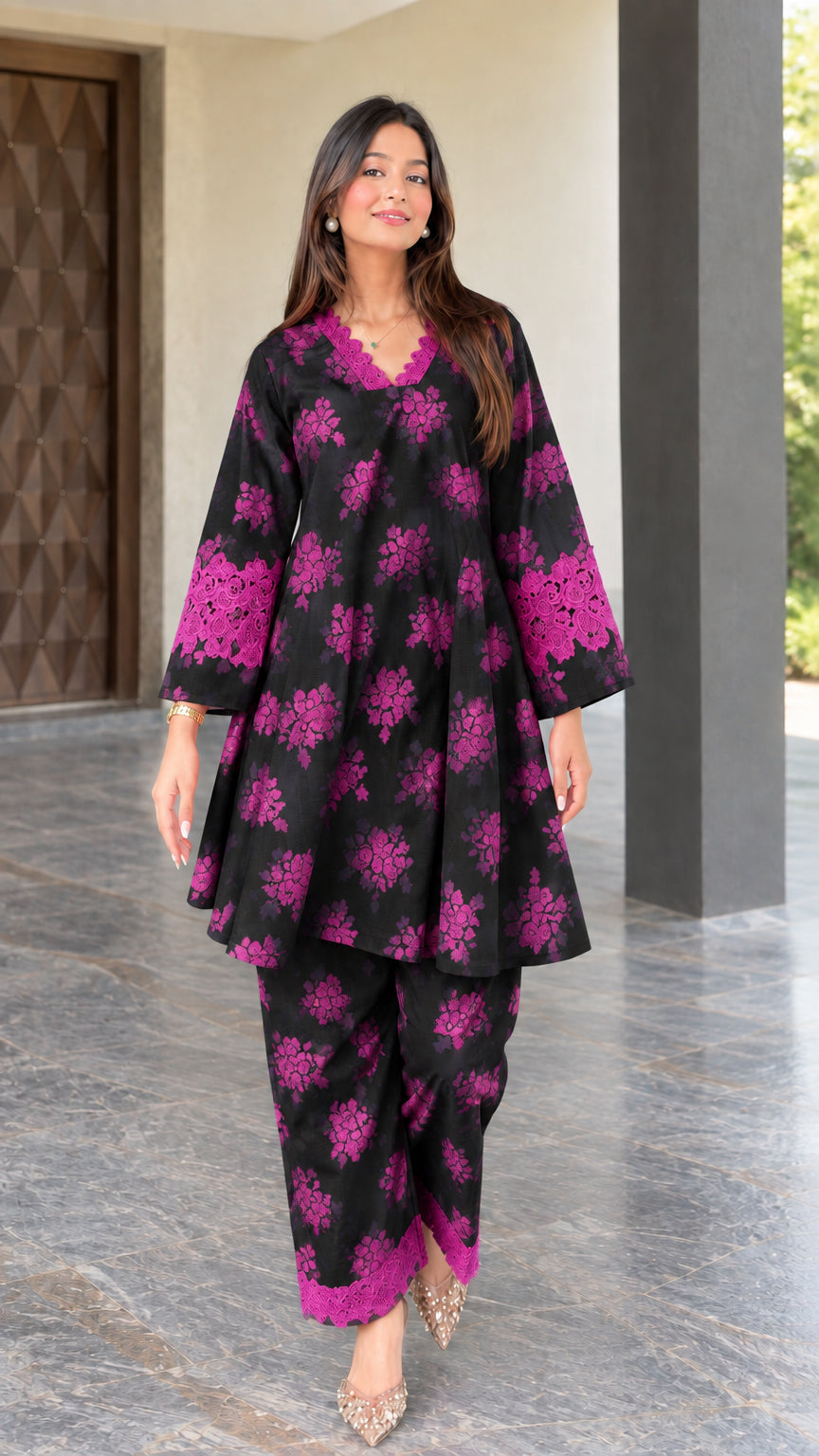 Front view of black floral print two-piece tunic and pant set