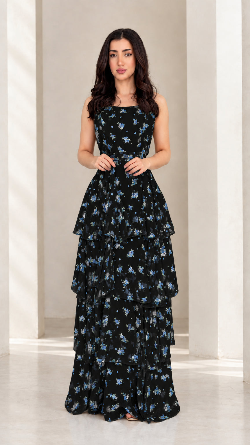 Model wearing black floral tiered ruffle spaghetti strap maxi dress