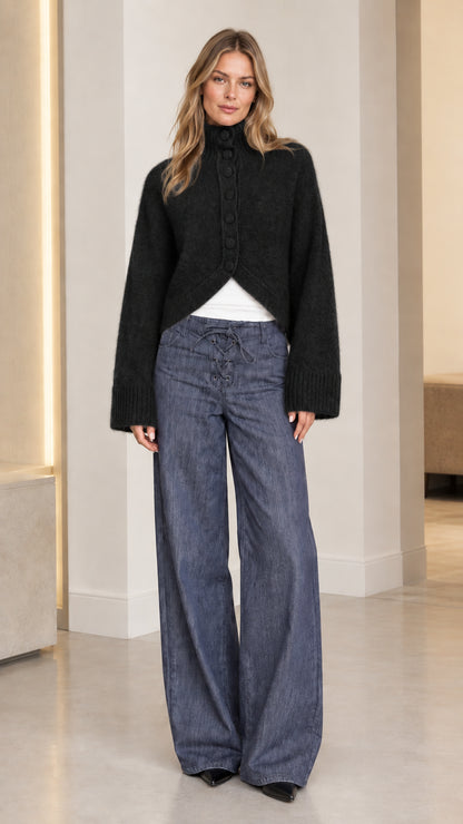Women's black high neck fuzzy knit cardigan with covered buttons and split hem