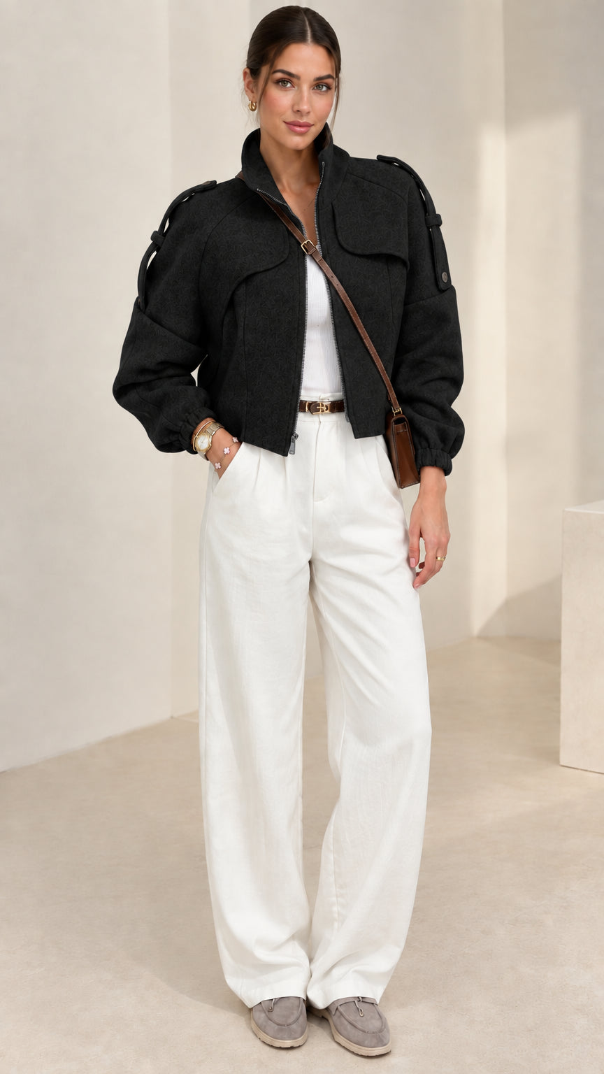 Black cropped stand collar utility jacket styled with white pants