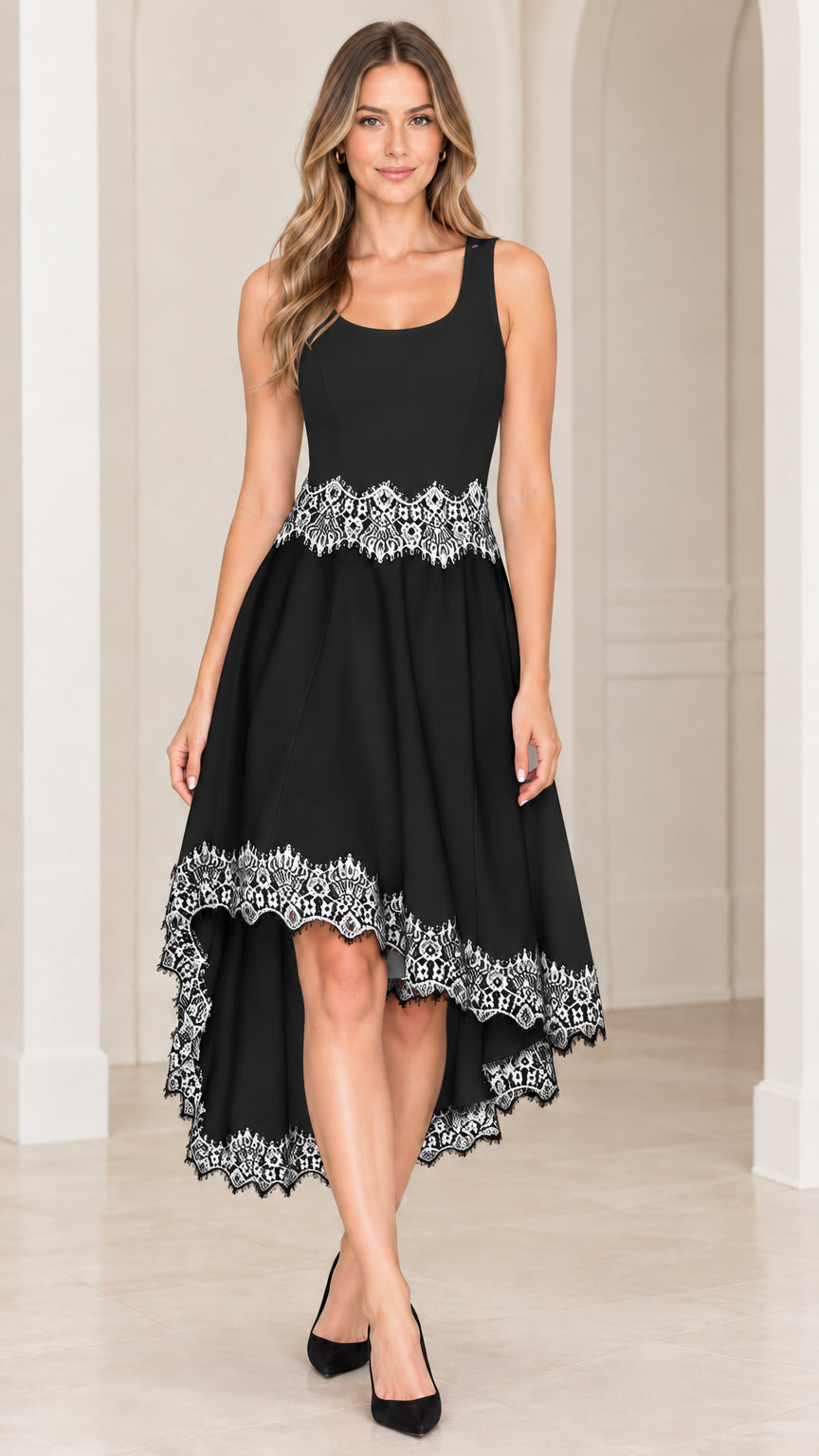 Front view of black sleeveless high-low cocktail dress with white lace detailing