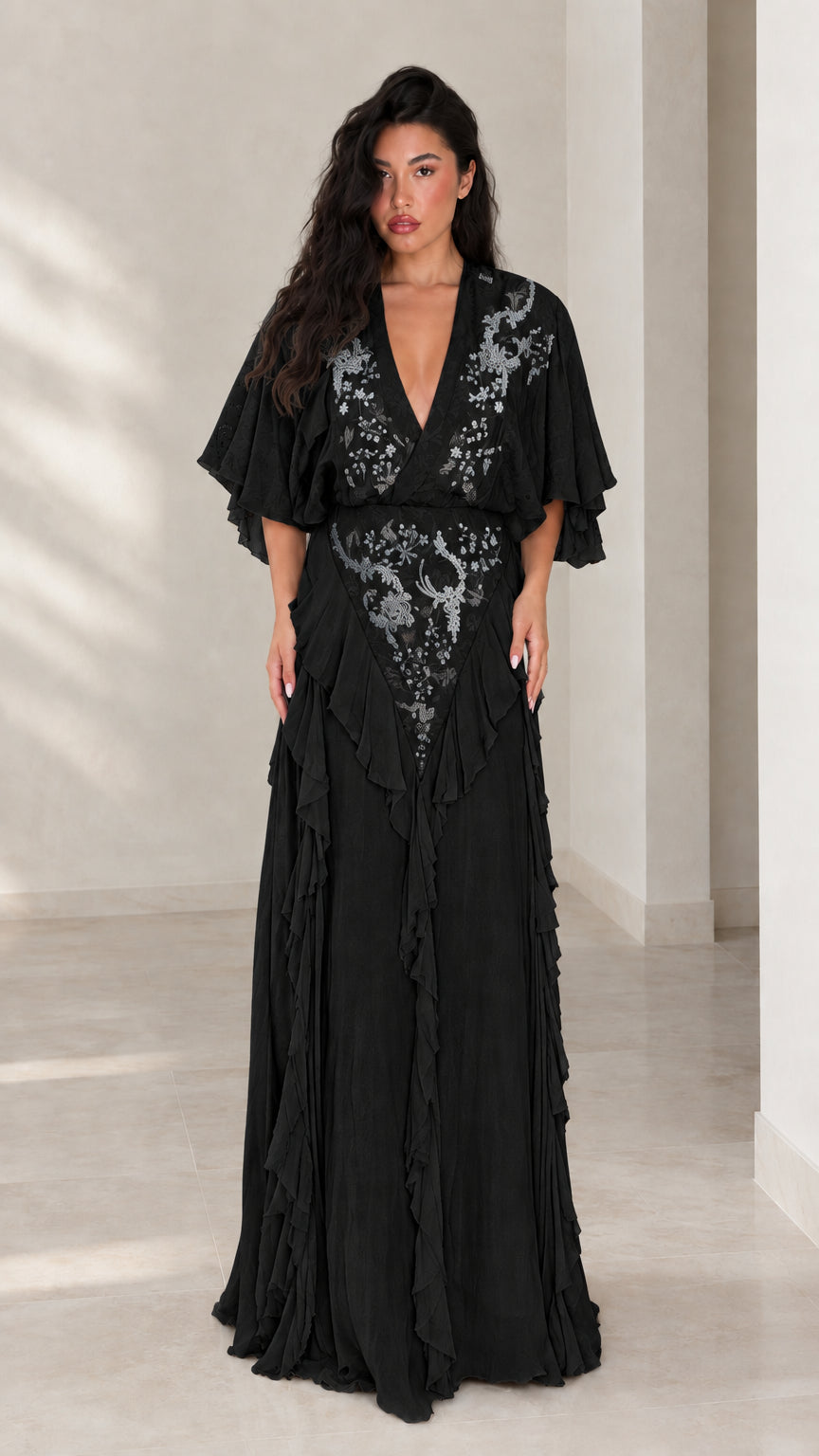 Front view of black embroidered V-neck flutter sleeve evening maxi gown