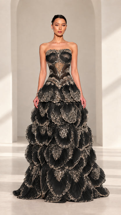 Front view of strapless beaded corset petal evening gown in Black