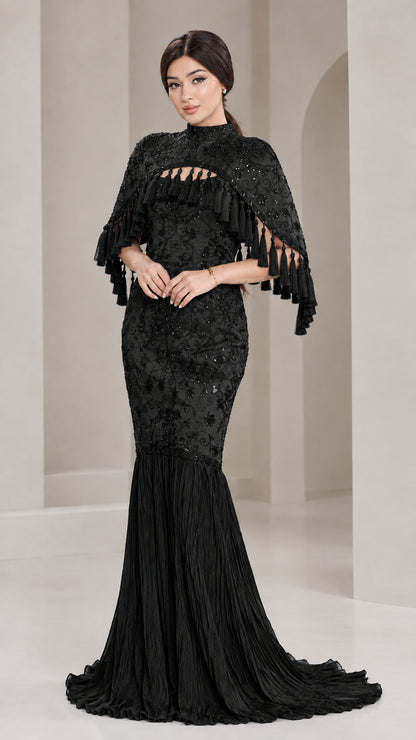 Front view of model wearing Black sequined cape mermaid formal evening gown