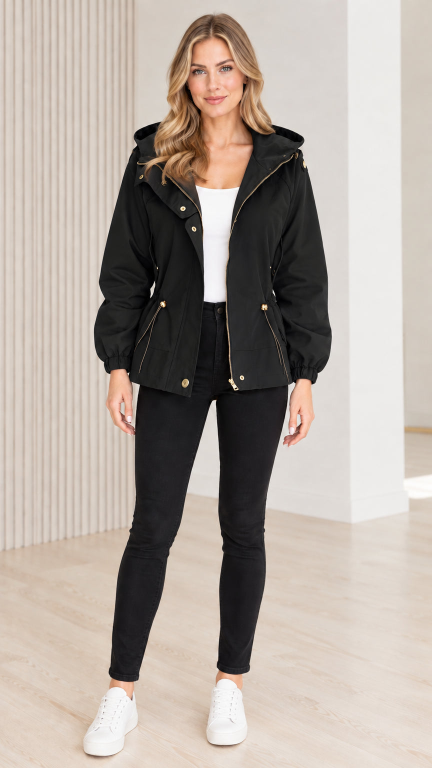 Front view of model wearing black hooded drawstring utility jacket