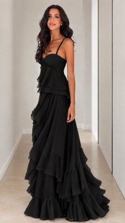 Front full-length view of model wearing Black tiered ruffle chiffon maxi gown