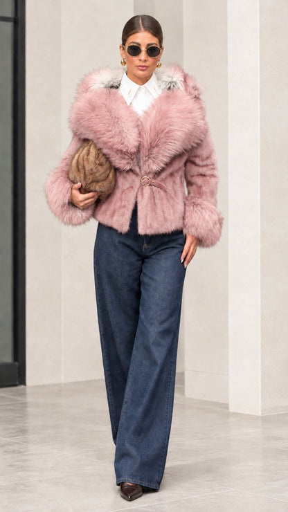 Woman wearing dusty pink monochrome faux fur trimmed hooded short jacket