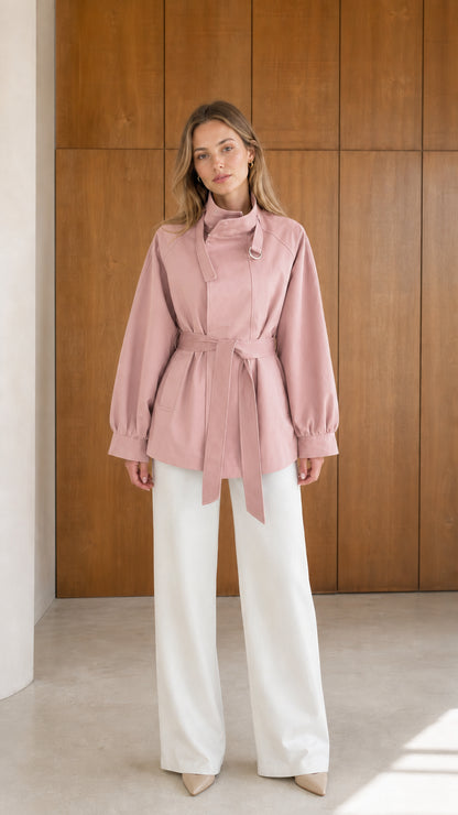 Model wearing dusty pink high neck belted short trench jacket