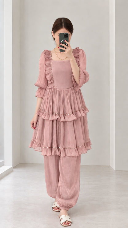 Front view of woman wearing Dusty Pink tiered ruffle square neck two-piece outfit