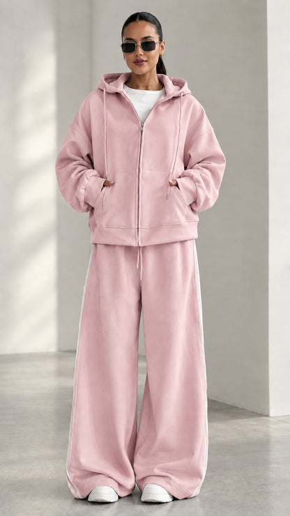 Model wearing Dusty Pink zip-up hoodie and matching wide-leg track pants set