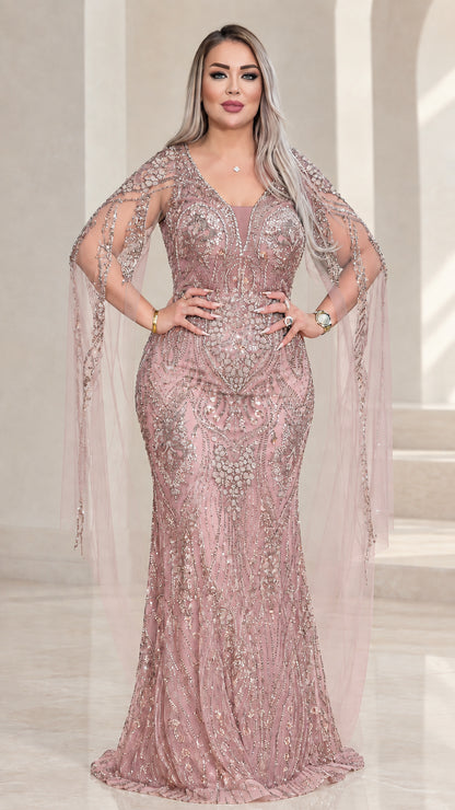 Front view of dusty rose pink sequined evening gown with cape sleeves