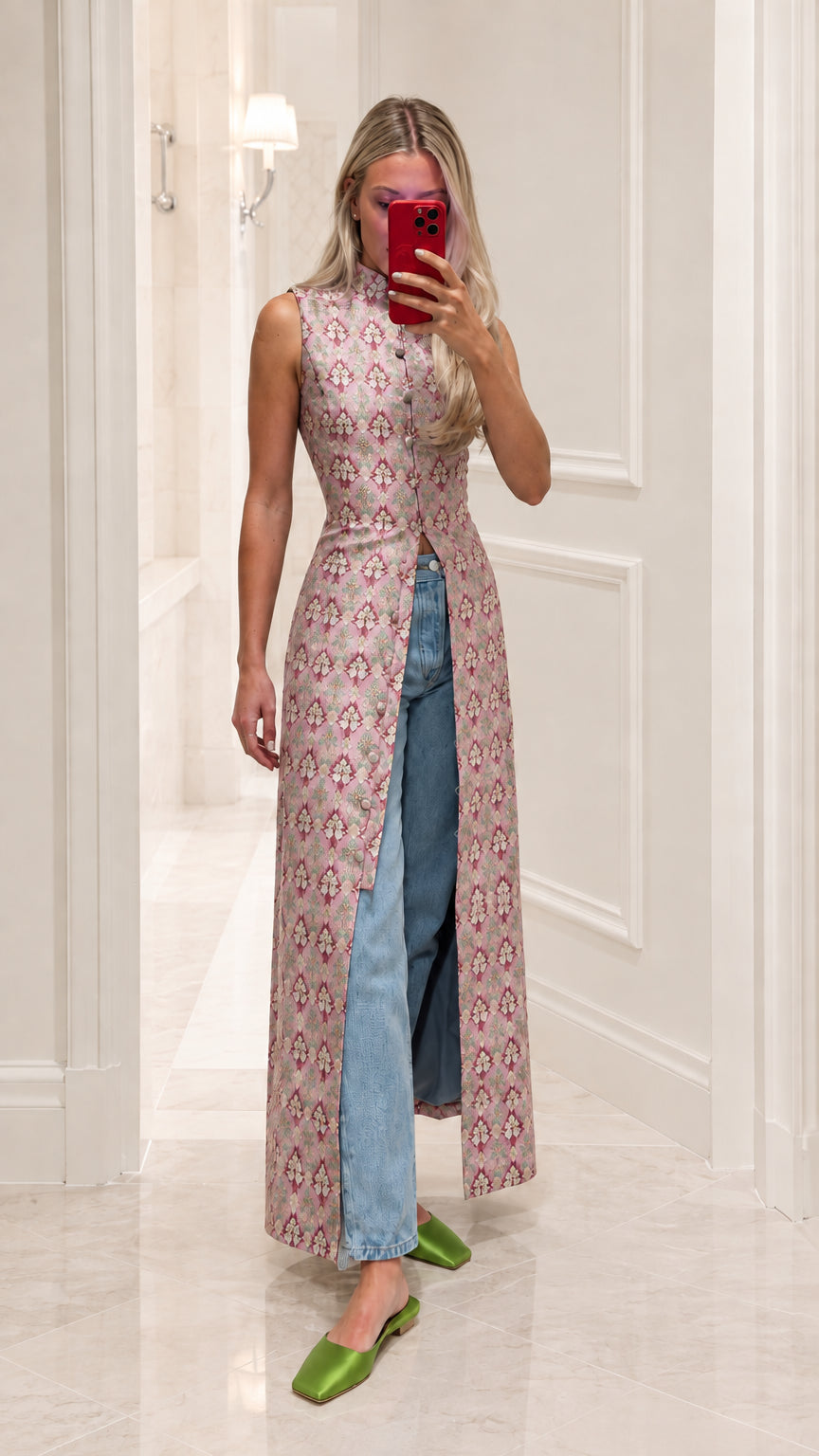 Model wearing blush pink patterned brocade maxi tunic with front slit