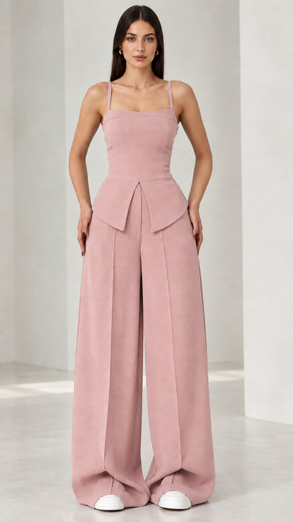 Full front view of model wearing dusty pink square neck peplum wide leg jumpsuit