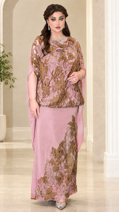 Model wearing dusty pink evening maxi dress with embroidered cape overlay