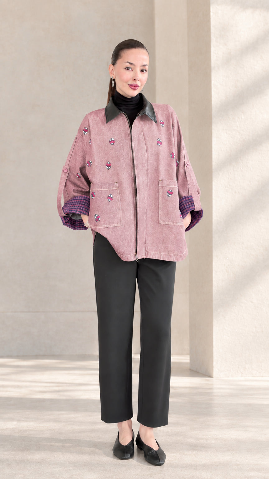Dusty Rose embroidered zip-up jacket with black contrast collar on model