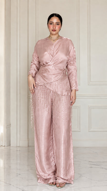 Full-length view of model wearing Dusty Rose satin draped two-piece set with beaded trim