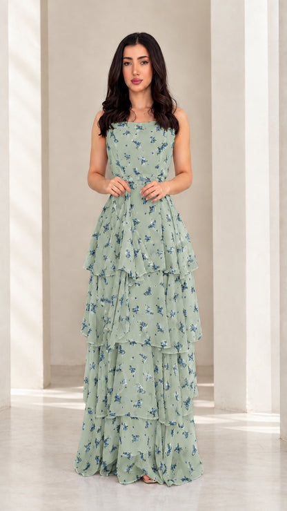 Model wearing sage green floral tiered ruffle maxi dress