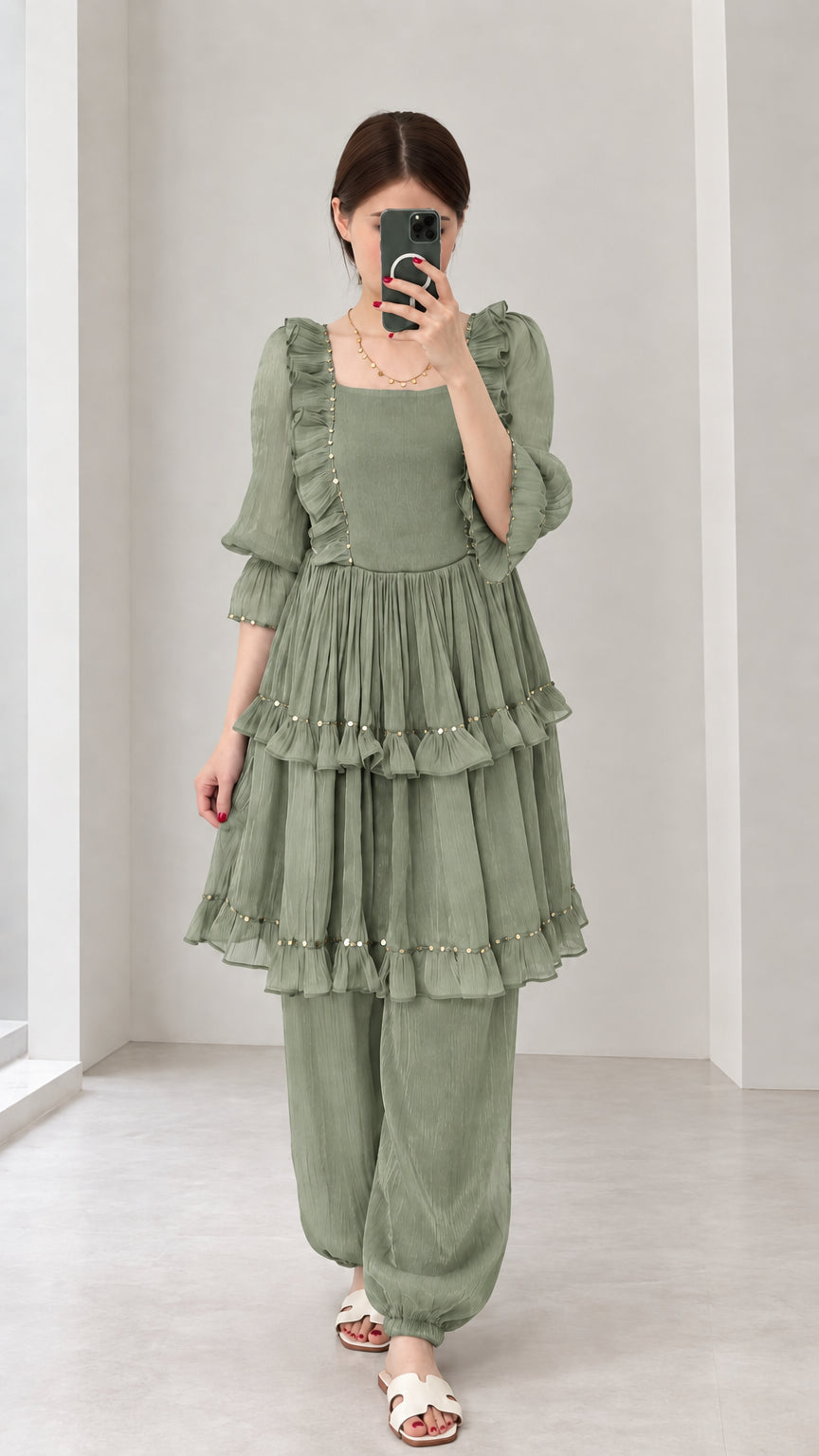 Front view of woman wearing Sage Green tiered ruffle tunic and loose pant set